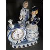 Image 4 : Porcelain Figurine Clock with Romantic Couple and Tea Set Design