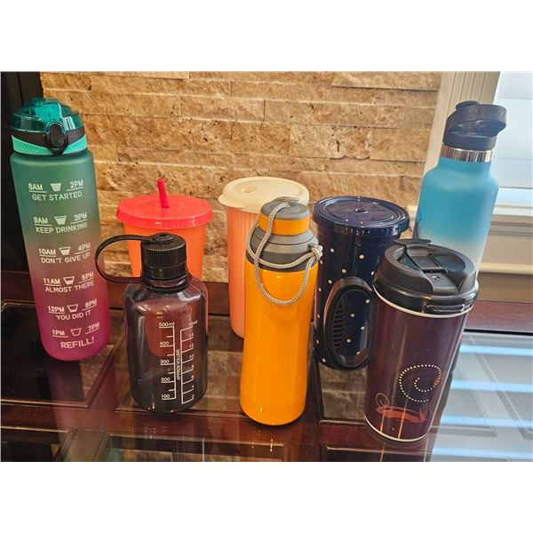 Seven Water Bottles in Various Styles and Colors