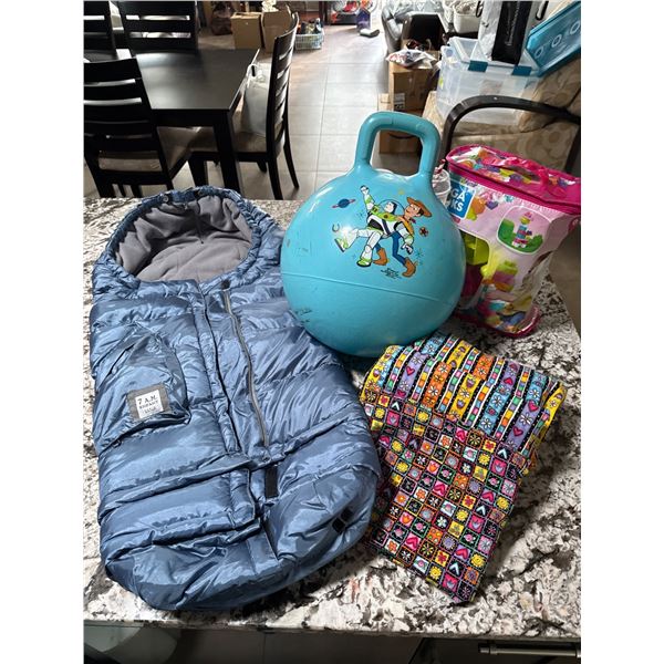 Childrens Items Including Toy Story Hopper Ball, Mega Bloks, Baby Sleeping Bag, and Fabric Bundle