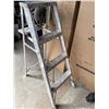 Image 3 : Utility Lot: Ladder, Storage Shelves, Circular Saw, and Trash Bins