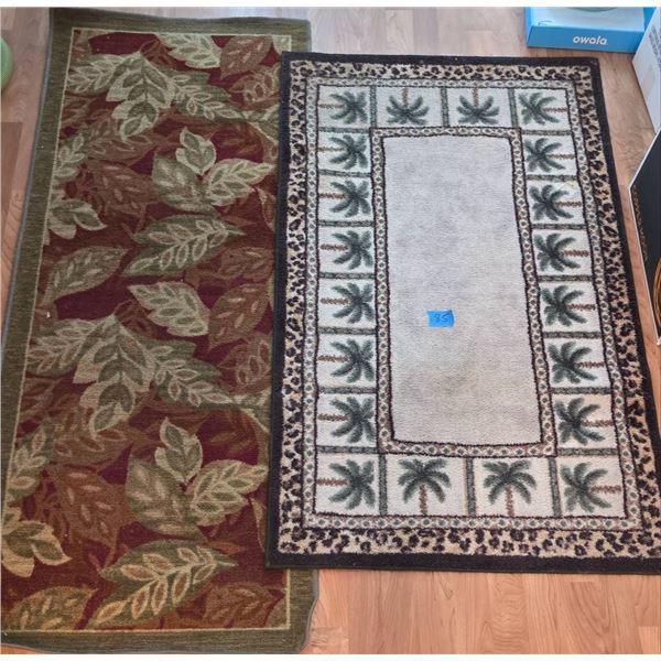 Two Decorative Area Rugs with Leaf and Palm Tree Motifs
