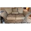 Image 1 : Two-Seat Upholstered Sofa with Floral and Striped Cushion Accents