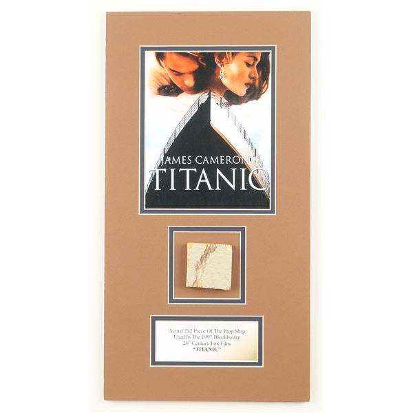 FRAMED TITANIC PRESENTATION PIECE FEATURING 2X2 PIECE OF THE PROP SHIP USED IN FILMING