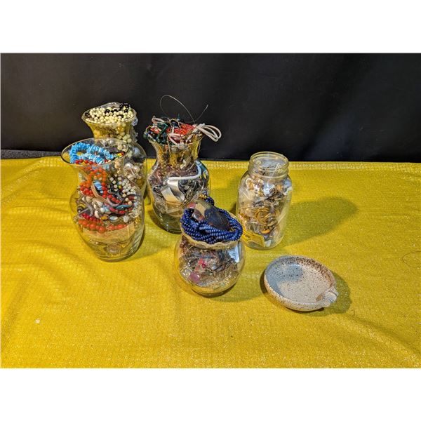 Jars Filled With Jewelry Including Necklaces, Bracelets, Watches, and More