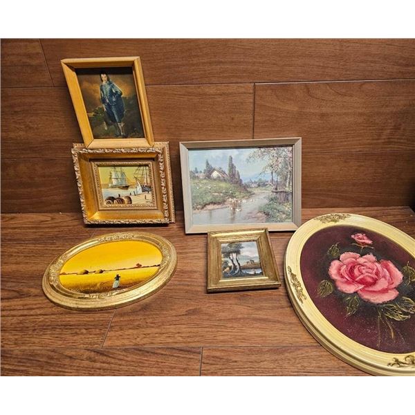 Seven Framed Artworks in Various Styles and Sizes