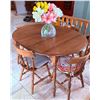 Image 2 : Oval Extendable Oak Dining Table with Four Spindle-Back Chairs