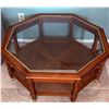Image 1 : Octagonal Glass-Top Coffee Table With Cane Shelves and Wooden Frame