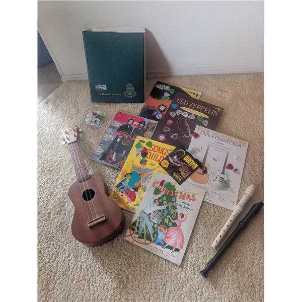 Musical Instrument Lot Featuring Ukulele, Recorders, and Songbooks
