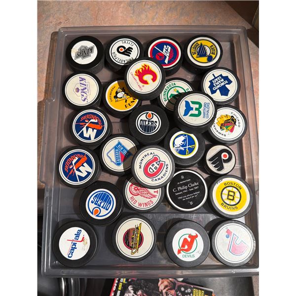 25 NHL Hockey Pucks Featuring Team Logos