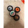 Image 2 : Four Hockey Sticks, Four NHL-Themed Pucks, and Two Training Cones