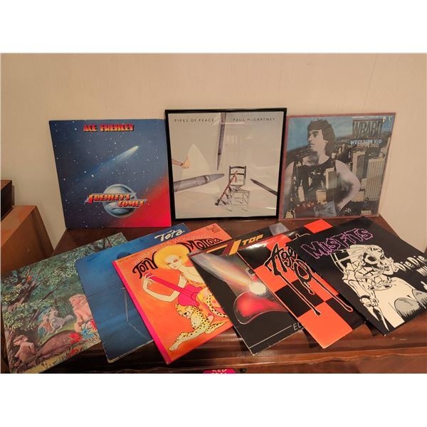 Fist Full Of Vinyl Records Featuring Various Artists and Genres