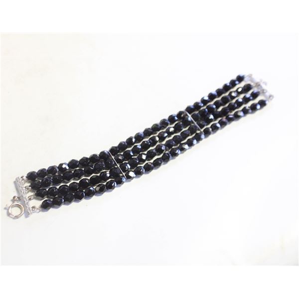 MULTI-STRAND BLACK FACETED BEAD BRACELET