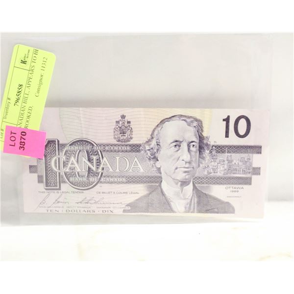 $10 CANADIAN BILL, APPEARS TO BE CUT CROOKED,