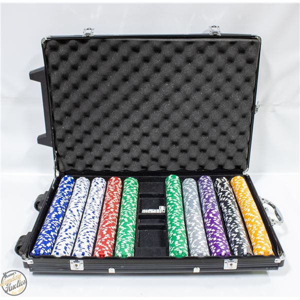 HEAVY POKER CHIP SET. CASE HAS HANDLE AND ROLLERS.