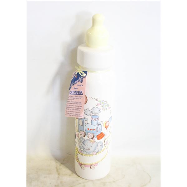 VINTAGE 1986 MUSICAL BABY BOTTLE BANK PLAYS "ITS A