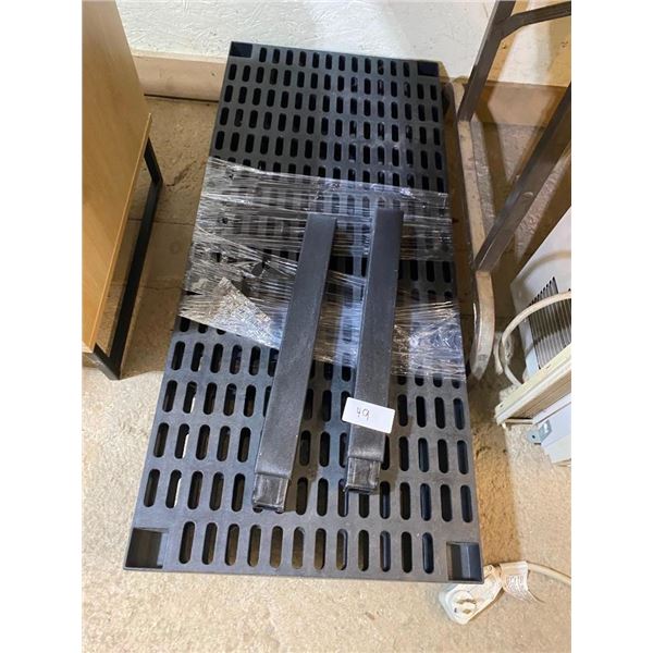 SOME SORT OF HARD PLASTIC SHELF OR STAND