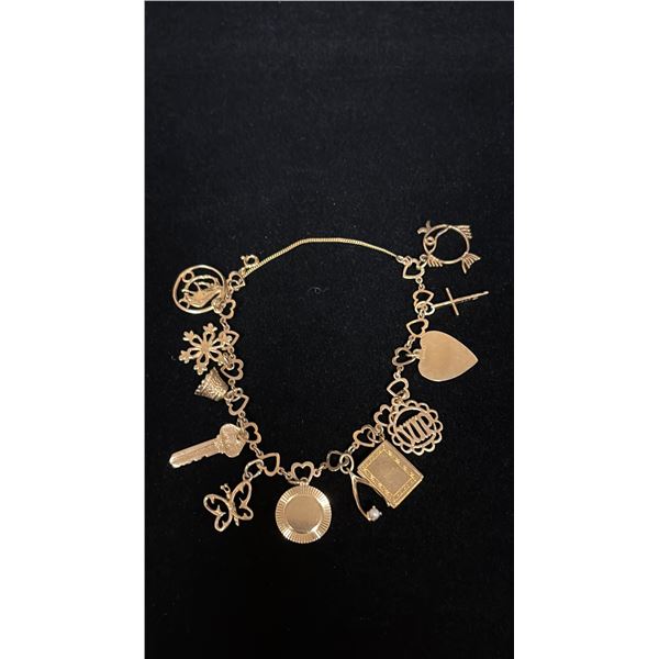 APPROX 10K CHARM BRACELET WITH MULTIPLE APPROX 9K+ CHARMS (18.8G)