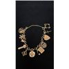 Image 1 : APPROX 10K CHARM BRACELET WITH MULTIPLE APPROX 9K+ CHARMS (18.8G)