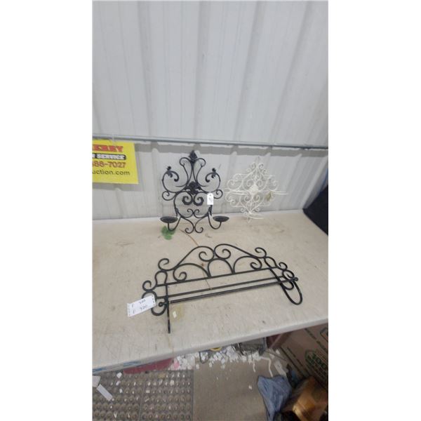Black Wrought Iron Wall Candle Sconce, Towel Rack, and White Scrollwork Decor