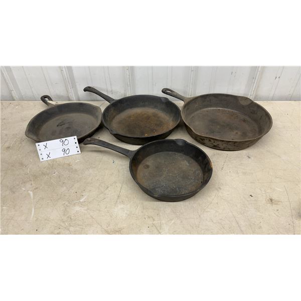 Collection of Four Vintage Cast Iron Skillets in Various Sizes