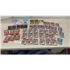 Image 1 : 50 Packs Trading Cards: Trash Pack, Dinosaurs, New Moon, Light-Up Yazzlies Badges and More
