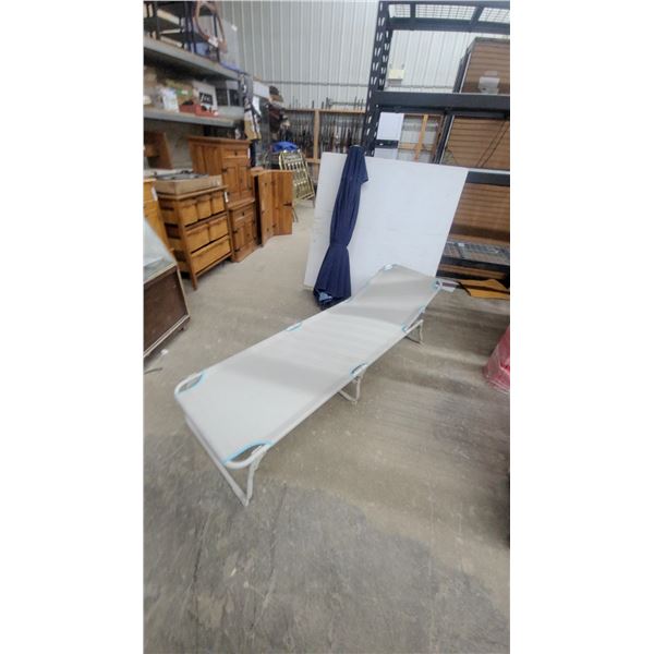 Folding Outdoor Lounger with White Metal Frame and Light Blue Reinforced Eyelets and Patio Umbrella