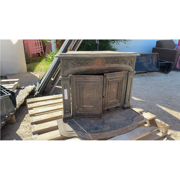 Antique Glenwood Cast Iron Fireplace Insert Stove with Ornate Scrollwork and Hearth Plate
