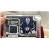 Image 2 : Connor Hellebuyck Rookie Materials Jersey Card