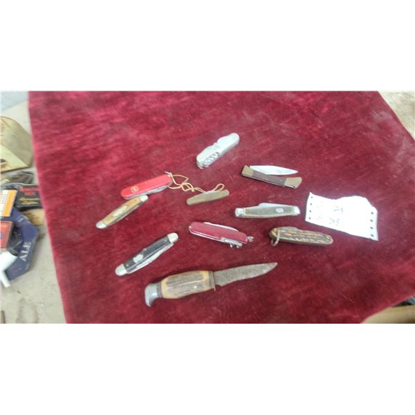 Collection of Pocket Knives Including Victorinox Swiss Army Knives, Fixed-Blade Hunting Knife, And