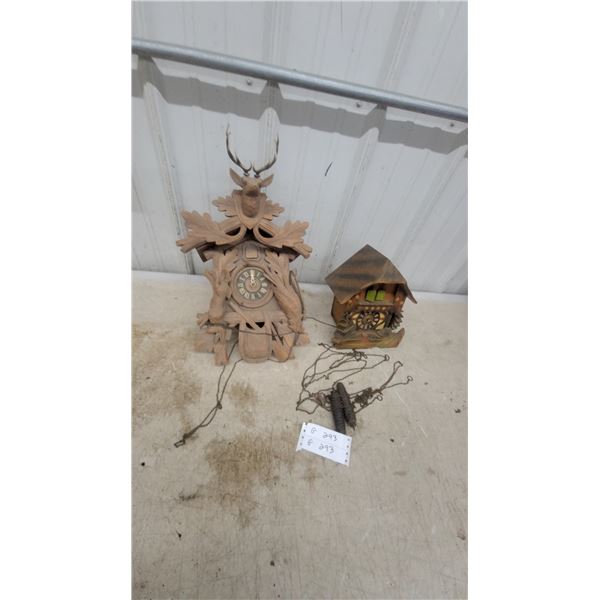 Two Black Forest Cuckoo Clocks with Carved Hunting Theme and Stag Head Antlers