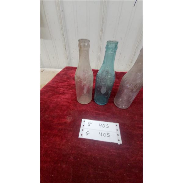 Three Vintage Coca-Cola Embossed Contour Glass Bottles, Clear and Blue-Green One Chipped