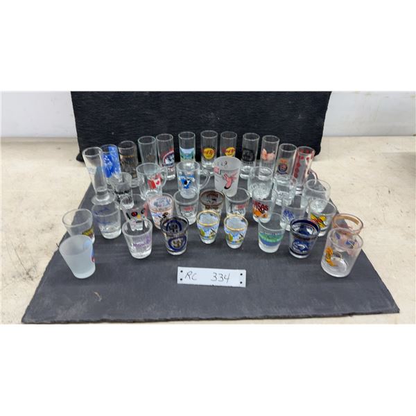 Collection of Souvenir Shot Glasses Including Hard Rock Cafe, Kansas, Montana, and More