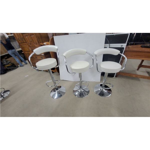 Set of Three White Upholstered Adjustable Swivel Bar Stools with Chrome Pedestal Bases