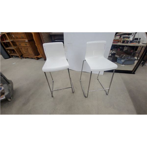 Pair of White Molded Plastic Counter-Height Stools with Chrome Tubular Steel Sled Bases
