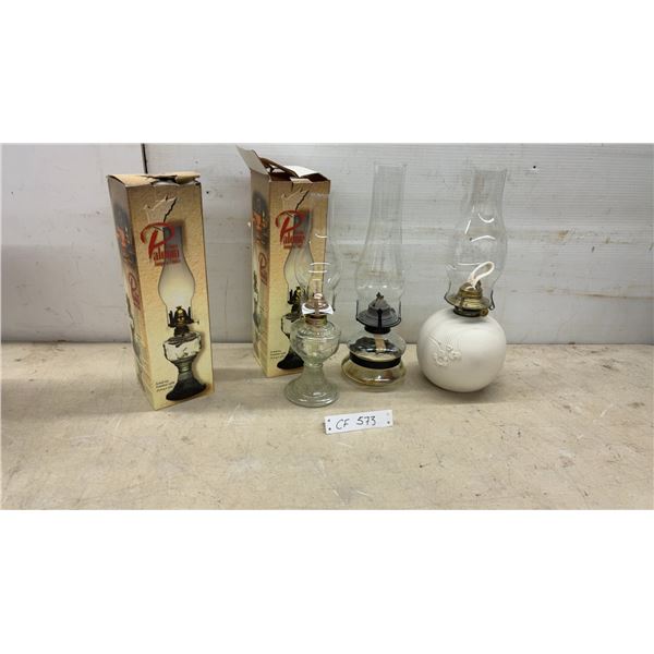 4 Oil Lamps Including Two Paloma Brand in Box, All with Chimneys