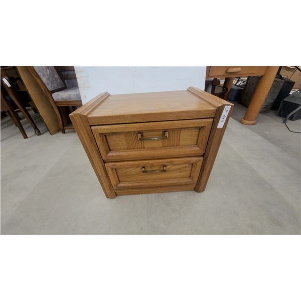 Oak Two-Door Cabinet with Brass-Toned Handles and Two Drawers 22 x 25 x 17"