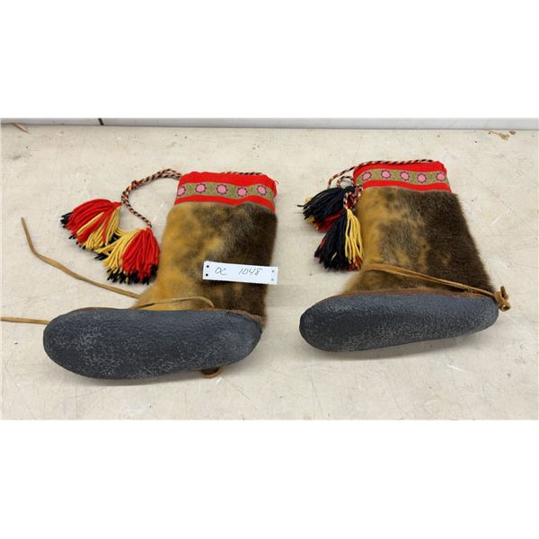 Pair of Traditional Sami Reindeer Hide Fur Boots with Woven Cuffs and Tassels.