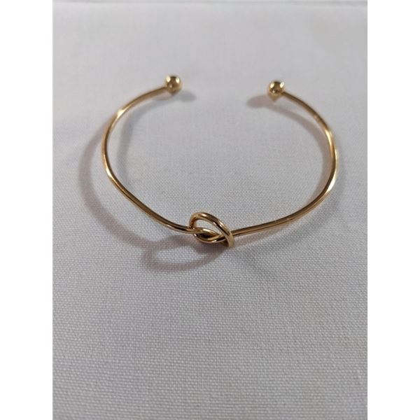GOLD TONE LOVE KNOT OPEN CUFF BANGLE
