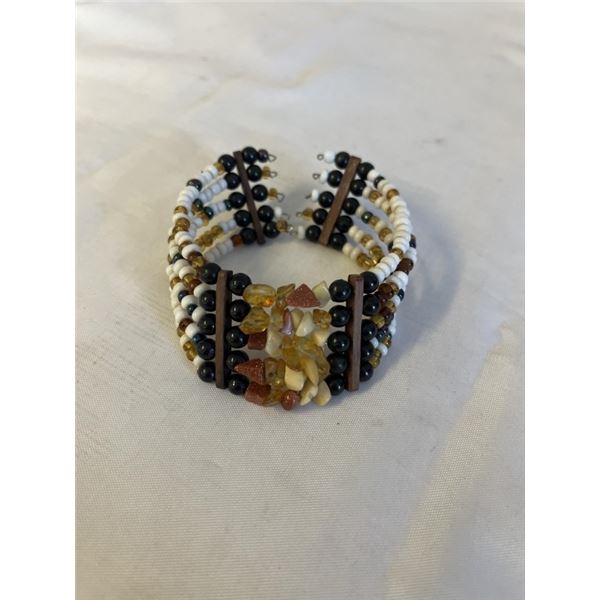 5 STRAND AMBER, GOLD STONE ETC BRACELET