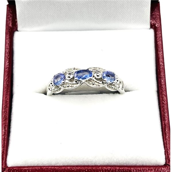 STERLING SILVER NATURAL TANZANITE AND CZ RING, SIZE 8, W/A $550.00. TANZANITE IS THE BIRTHSTONE FOR 