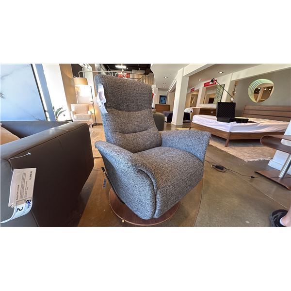 HJORT KNUDSEN SWIVEL CHAIR. LEVER CHANGES FUNCTION FROM GLIDE TO RECLINE. RETAIL $3795