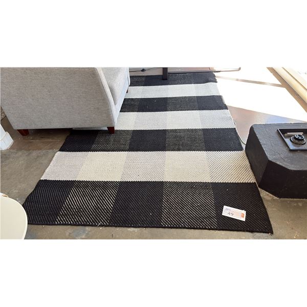 EQ3 FURROW RUG 9' X 5'. HANDWOVEN FROM 100% WOOL. BLACK AND WHITE, RETAIL $500