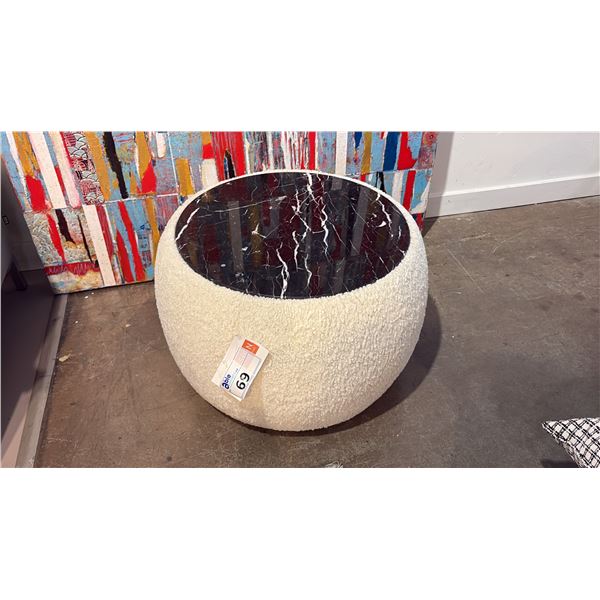 PALLISER DOLLOP OTTOMAN. SHEEPSKIN FINISH WITH BLACK MARBLE TOP. 26" DIAMETER. RETAIL $900