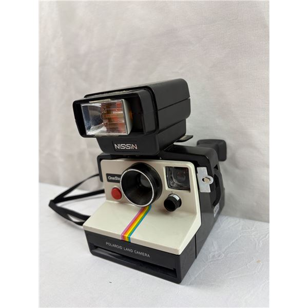Vintage Polaroid Camera with flash accessory
