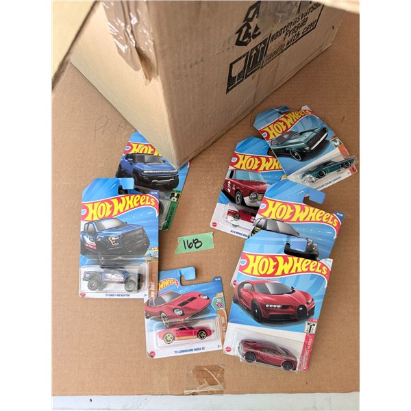 GROUP OF HOT WHEELS DIECAST CARS IN PACKAGES