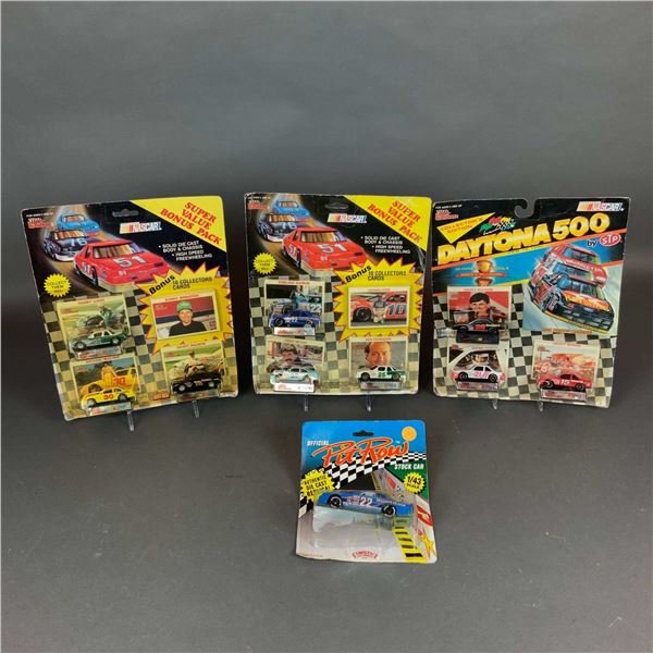 An Assortment of Four Vintage NASCAR Model Cars and Die-Cast Sets