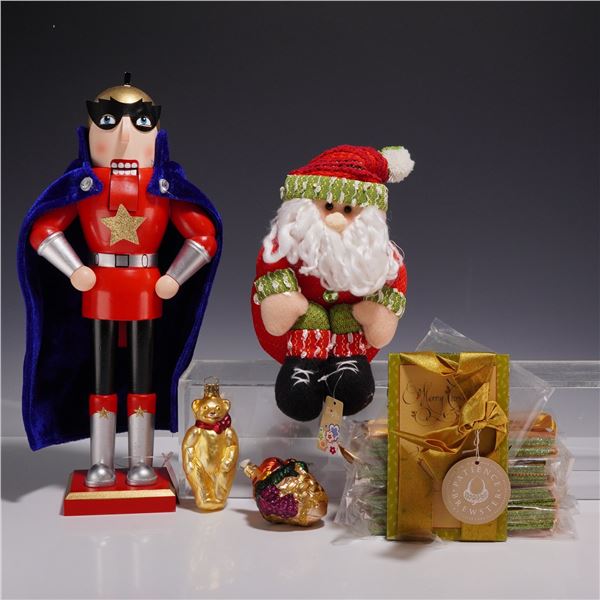 13pc Christmas Grouping Including Macy's Superhero Nutcracker and Sitting Santa Decoration