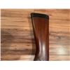 Image 11 : Cooey  model 34 single barrel shotgun featuring a wooden stock and blued metal receiver. The receive