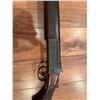 Image 3 : Cooey  model 34 single barrel shotgun featuring a wooden stock and blued metal receiver. The receive