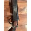 Image 4 : Cooey  model 34 single barrel shotgun featuring a wooden stock and blued metal receiver. The receive